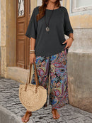 Conjunto camisa em gola redonda e calças de perna larga Ligía