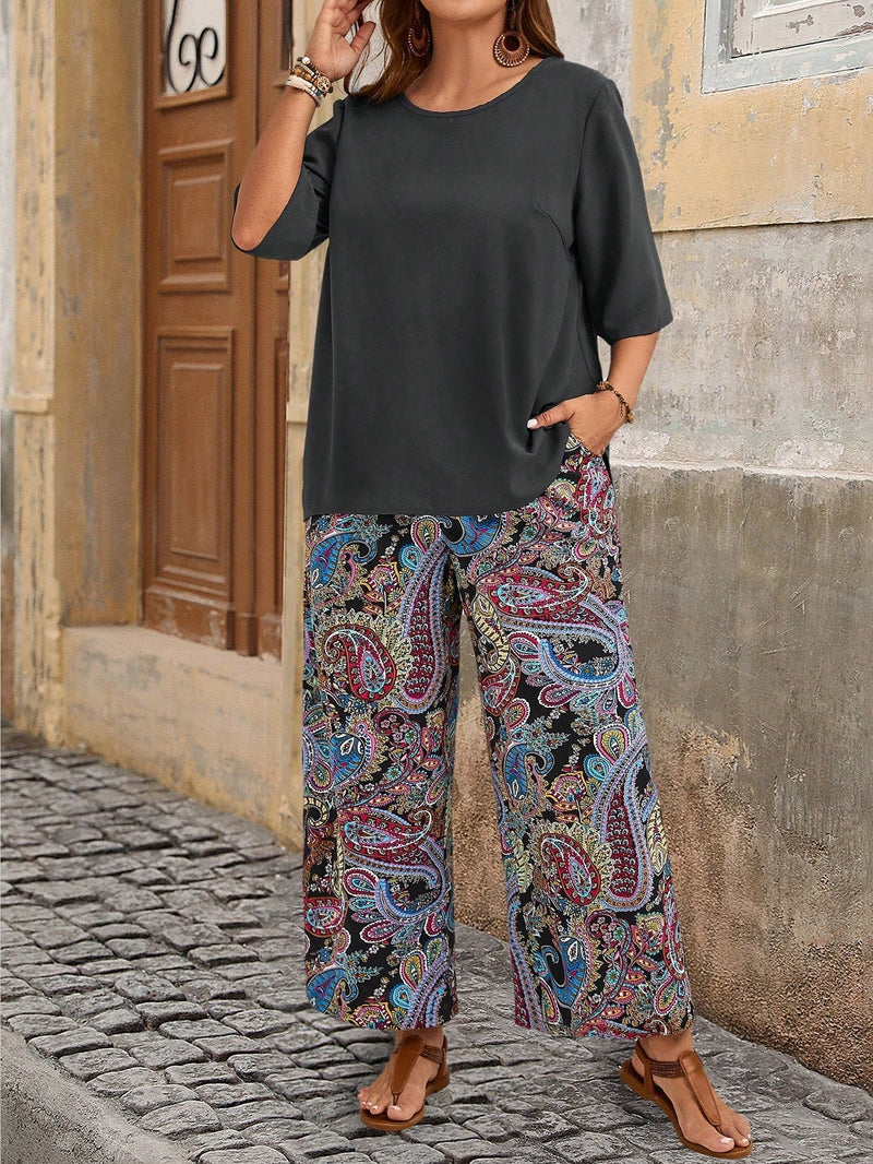 Conjunto camisa em gola redonda e calças de perna larga Ligía