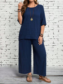 Conjunto camisa em gola redonda e calças de perna larga Ligía